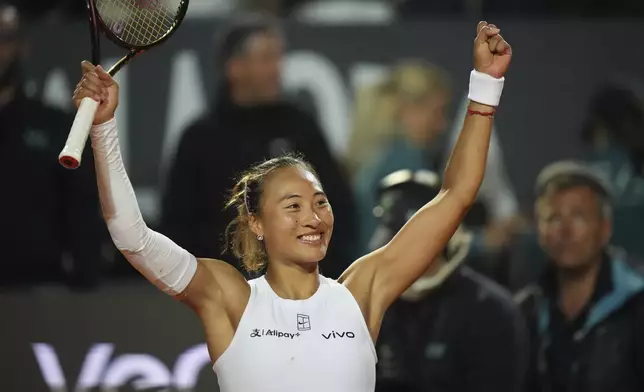 China's Qinwen Zheng celebrates after winning a quarter-final tennis match against Aryna Sabalenka of Belarus at the Italian Open in Rome, Italy, Wednesday, May 14, 2025. (AP Photo/Alessandra Tarantino)
