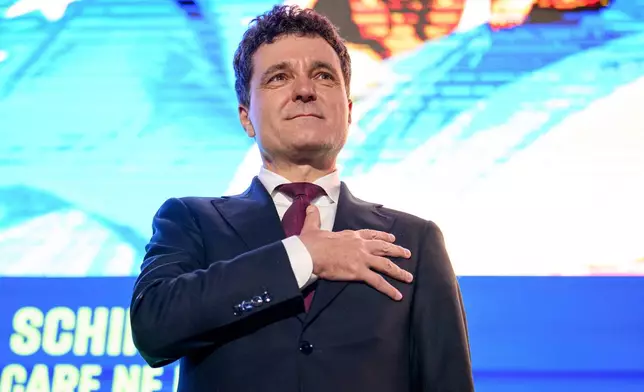 Presidential candidate Nicusor Dan gestures during an electoral rally a week ahead of the second round of the country's presidential election redo in Bucharest, Romania, Sunday, May 11, 2025. (AP Photo/Andreea Alexandru)