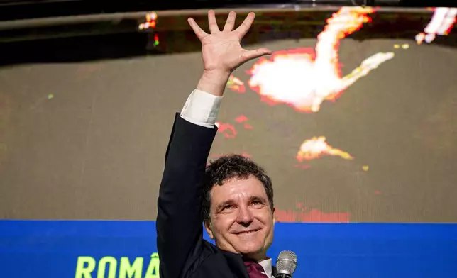 Presidential candidate Nicusor Dan gestures during an electoral rally a week ahead of the second round of the country's presidential election redo in Bucharest, Romania, Sunday, May 11, 2025. (AP Photo/Andreea Alexandru)