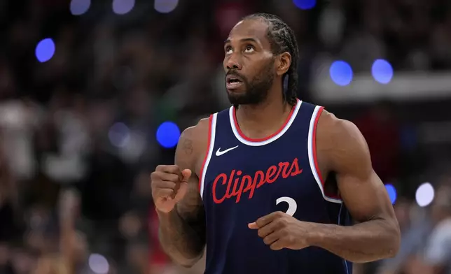 Los Angeles Clippers forward Kawhi Leonard celebrates after scoring during the second half in Game 6 of an NBA basketball first-round playoff series against the Denver Nuggets, Thursday, May 1, 2025, in Inglewood, Calif. (AP Photo/Mark J. Terrill)