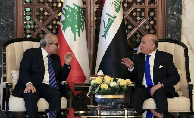 Iraqi Foreign Minister Fuad Hussein meets with Lebanese Prime Minister Nawaf Salam ahead of the 34th Arab League summit in Baghdad, Iraq, Friday, May 16, 2025. (Thaier Al-Sudani/Pool Photo via AP)