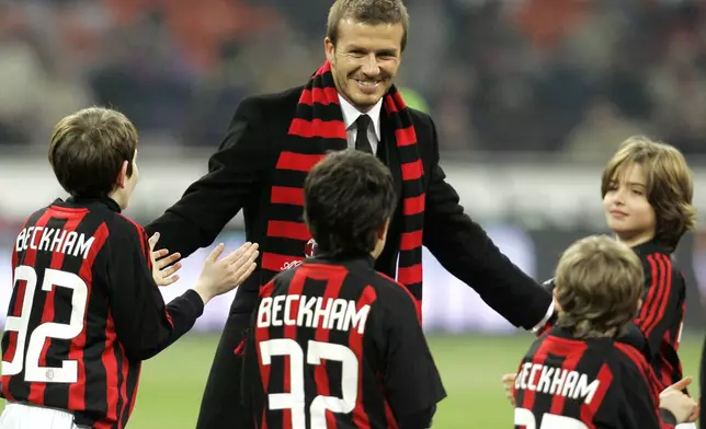 FILE - British soccer star David Beckham smiles prior to the start of a Serie A soccer match between AC Milan and Udinese at the San Siro stadium in Milan, Italy, Sunday, Dec. 21, 2008. (AP Photo/ Antonio Calanni, File)