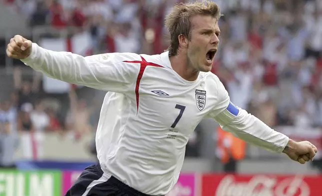 FILE - England's David Beckham celebrates after scoring the opening goal during the Round of 16 World Cup soccer match against Ecuador in Stuttgart, Germany, June 25, 2006. (AP Photo/Matt Dunham, File)