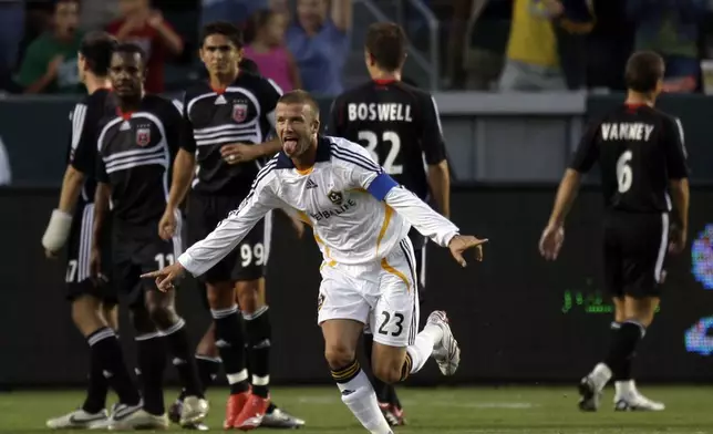 FILE - Los Angeles Galaxy's David Beckham celebrates after scoring on a free kick against D.C. United during the SuperLiga semifinal soccer game at the Home Depot Center in Carson, Calif., Aug. 15, 2007. (AP Photo/Kevork Djansezian, File)