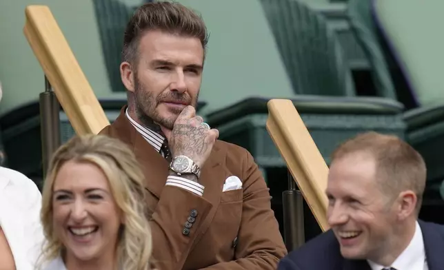 Former England soccer player David Beckham sits in the Royal Box before a men's singles quarterfinal match on day ten of the Wimbledon tennis championships in London, Wednesday, July 6, 2022. (AP Photo/Kirsty Wigglesworth, File)
