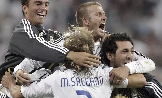 FILE - Real Madrid player David Beckham, center, celebrates after a teammate scored during the Spanish League soccer match against Mallorca in Madrid, Spain, June 17, 2007. (AP Photo/Jasper Juinen, FIle)