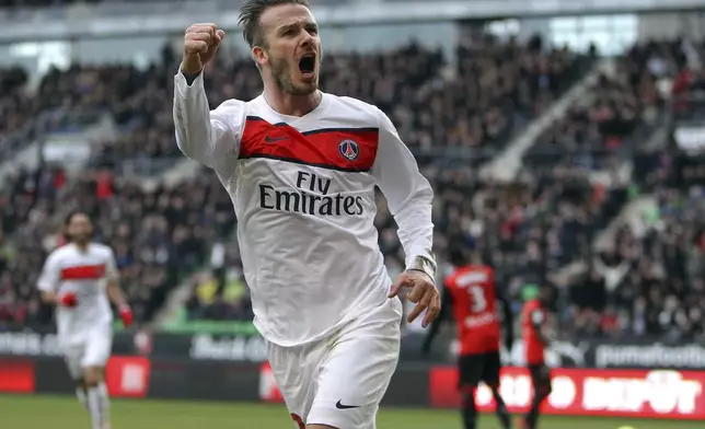 FILE - PSG's David Beckham celebrates after scoring a goal against Rennes during their French League One soccer match, in Rennes, western France, Saturday, April 6, 2013. (AP Photo/David Vincent, File)