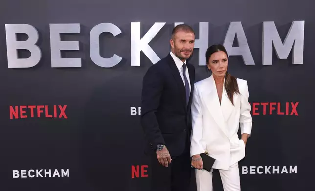 FILE - David Beckham, left, and Victoria Beckham pose for photographers upon arrival at the premiere of the television programme 'Beckham' on Tuesday, Oct. 3, 2023 in London. (AP Photo/Vianney Le Caer, File)