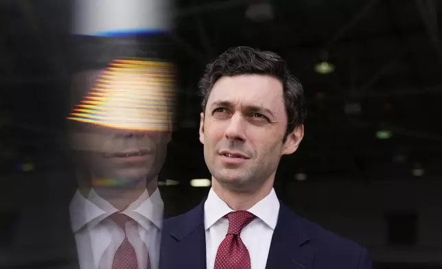 Sen. Jon Ossoff, D-Ga., speaks during an interview at Dobbins Air Reserve Base, Saturday, April 26, 2025, in Marietta, Ga. (AP Photo/Brynn Anderson)