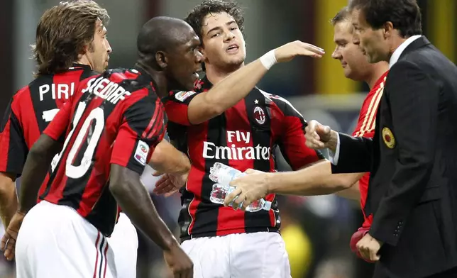 FILE -AC Milan Brazilian forward Pato, center, celebrates with his teammates from left, Andrea Pirlo, Clarence Seedorf of the Netherlands, and coach Massimiliano Allegri, right, after scoring during the Serie A soccer match between AC Milan and Lecce at the San Siro stadium in Milan, Italy, Aug 29, 2010. (AP Photo / Antonio Calanni, File)