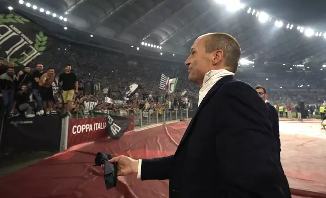 FILE - Juventus' head coach Massimiliano Allegri throws away his tie in anger as he leaves the pitch after getting a red card during the Italian Cup final soccer match between Atalanta and Juventus at Rome's Olympic Stadium, May 15, 2024. (AP Photo/Gregorio Borgia, File)