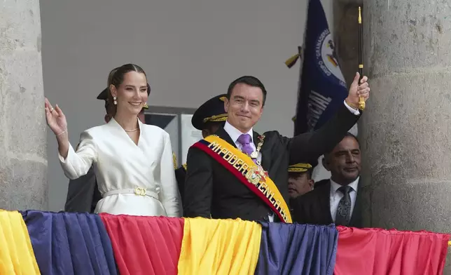 Ecuador's President Daniel Noboai and his wife, Lavinia Valbonesi, wave from the balcony of the presidential palace after his swearing-in ceremony for a second term in Quito, Ecuador, Saturday, May 24, 2025. (AP Photo/Carlos Noriega)
