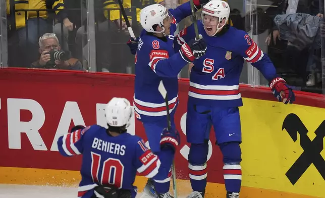 United States players celebrate after a goal during the semifinal match between Sweden and the United States at the ice hockey world championships in Stockholm,Sweden, Saturday, May 24, 2025. (AP Photo/Petr David Josek)