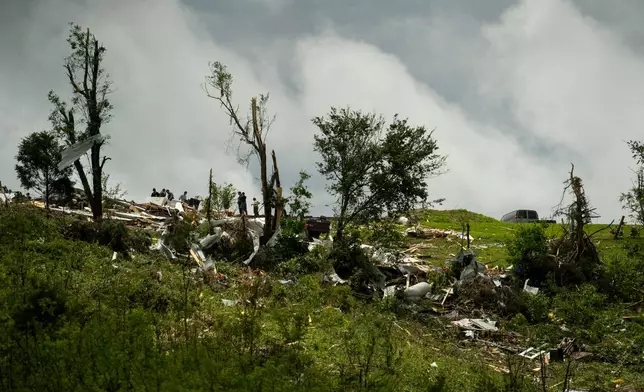Debris and heavy damage are seen from severe weather, Friday, May 30, 2025, in Springfield, Ky. (AP Photo/Michael Swensen)