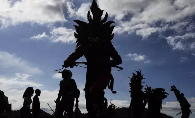 Revelers take part in the Devils and Congos Festival in Portobelo, Panama, Saturday, May 3, 2025. (AP Photo/Matias Delacroix)