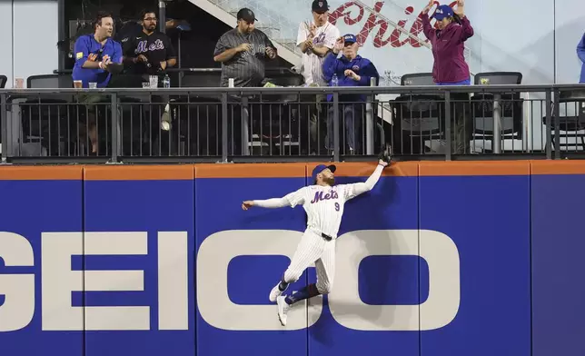 New York Mets outfielder Brandon Nimmo (9) catches a ball hit by Pittsburgh Pirates' Joey Bart during the eighth inning of a baseball game Monday, May 12, 2025, in New York. (AP Photo/Pamela Smith)