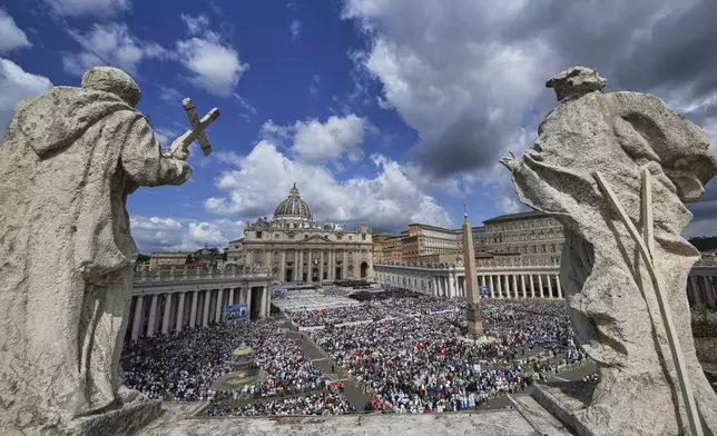 Faithful gather as Pope Leo XIV celebrates a Mass for the formal inauguration of his pontificate, in St. Peter's Square at the Vatican, Sunday, May 18, 2025. (AP Photo/Domenico Stinellis)
