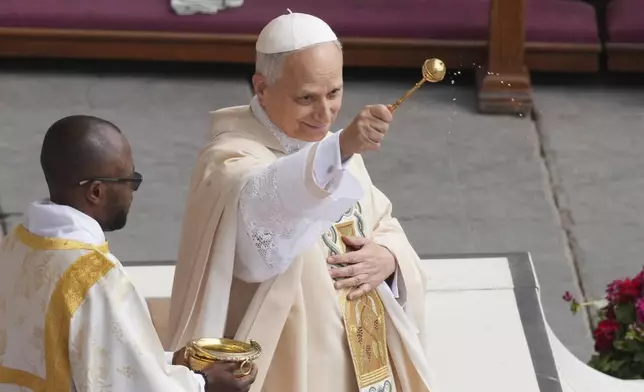 Pope Leo XIV celebrates a Mass for the formal inauguration of his pontificate, in St. Peter's Square attended by heads of state, royalty and ordinary faithful, Sunday, May 18, 2025. (AP Photo/Stefano Costantino)