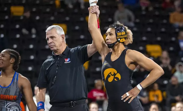 FILE - Iowa's Kennedy Blades is declared the winner after wrestling Indiana Tech's Cydney Bassett at 160 pounds during Day 1 of the Soldier Salute wrestling tournament at the Xtream Arena in Coralville, Iowa, on Sunday, Dec. 29, 2024. (Nick Rohlman/The Gazette via AP, File)