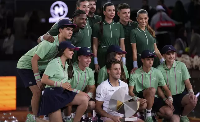 Norway's Casper Ruud poses with the trophy after winning the Madrid Open tennis final in Madrid, Spain, Sunday, May 4, 2025. (AP Photo/Manu Fernandez)