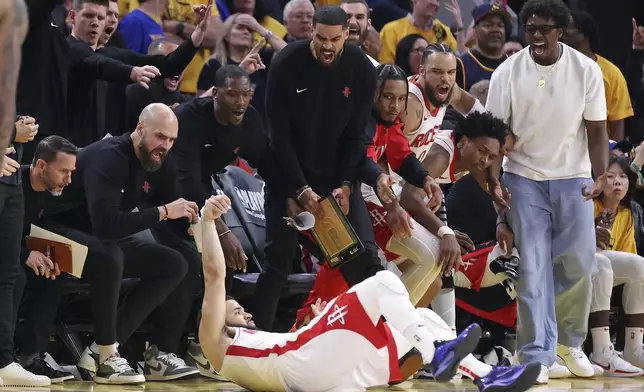 Houston Rockets' bench celebrates Fred VanVleet's three-pointer and a foul in fourth quarter of Game 6 of an NBA basketball first-round playoff series Friday, May 2, 2025, in San Francisco. (Scott Strazzante/San Francisco Chronicle via AP)