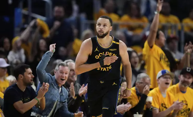 Golden State Warriors guard Stephen Curry reacts after making a 3-point basket during the second half of Game 6 of an NBA basketball first-round playoff series against the Houston Rockets, Friday, May 2, 2025, in San Francisco. (AP Photo/Godofredo A. Vásquez)