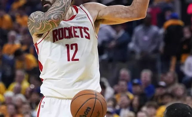 Houston Rockets center Steven Adams (12) dunks in front of Golden State Warriors forward Draymond Green during the second half of Game 6 of an NBA basketball first-round playoff series Friday, May 2, 2025, in San Francisco. (AP Photo/Godofredo A. Vásquez)