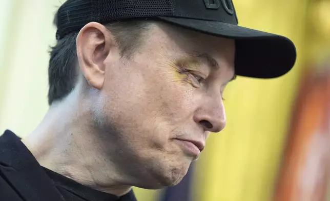 Elon Musk listens as President Donald Trump speaks during a news conference in the Oval Office of the White House, Friday, May 30, 2025, in Washington. (AP Photo/Evan Vucci)