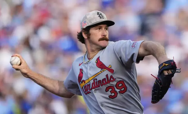 St. Louis Cardinals starting pitcher Miles Mikolas throws during the first inning of a baseball game against the Kansas City Royals, Saturday, May 17, 2025, in Kansas City, Mo. (AP Photo/Charlie Riedel)