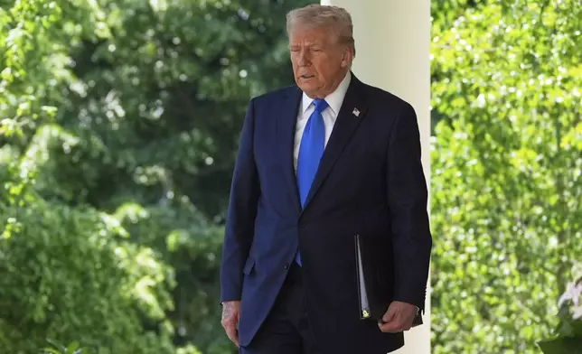 President Donald Trump arrives to speak during a National Day of Prayer event in the Rose Garden of the White House, Thursday, May 1, 2025, in Washington. (AP Photo/Evan Vucci)