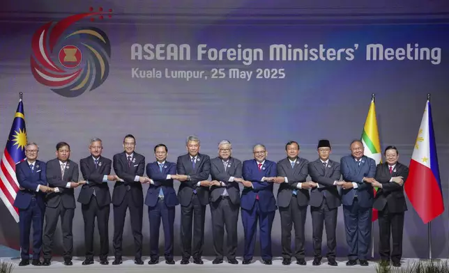 ASEAN Foreign Ministers line up for a photo call at the start of the Association of Southeast Asian Nations (ASEAN) Foreign Ministers' Meeting opening ceremony in Kuala Lumpur, Malaysia, Sunday, May 25, 2025. (AP Photo/Vincent Thian)
