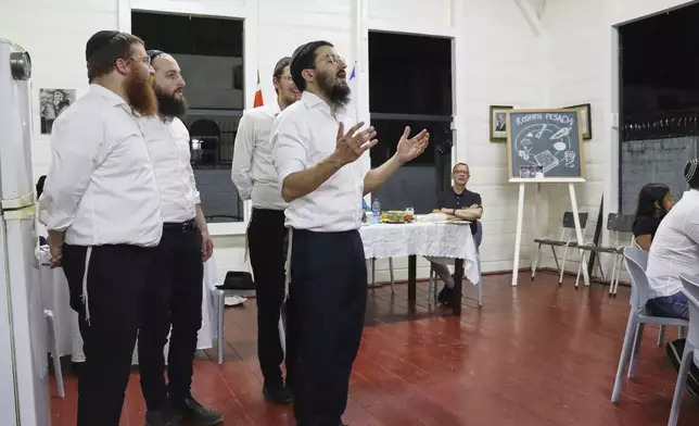 A group of American rabbis perform during Passover celebrations at the synagogue in Paramaribo, Suriname, Saturday, April 12, 2025. (AP Photo/Oscar Keur)
