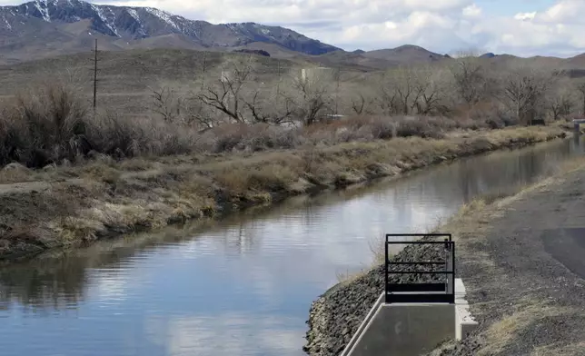 FILE — The view of an irrigation canal in Fernley, Nev. near Reno, March 18, 2021. (AP Photo/Scott Sonner, File)