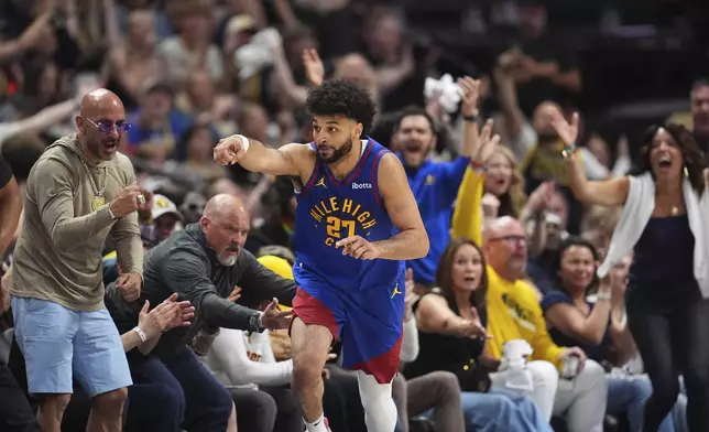 Denver Nuggets guard Jamal Murray (27) gestures after making a basket against the Los Angeles Clippers in the second half of Game 7 of an NBA basketball first-round playoff series Saturday, May 3, 2025, in Denver. (AP Photo/David Zalubowski)