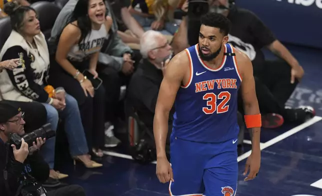 New York Knicks center Karl-Anthony Towns (32) reacts after scoring against the Indiana Pacers during the second half of Game 3 of the Eastern Conference finals of the NBA basketball playoffs Sunday, May 25, 2025, in Indianapolis. (AP Photo/Jeff Roberson)