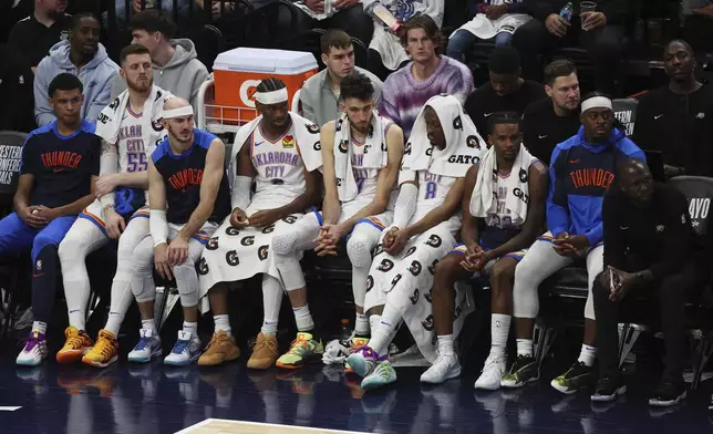 Oklahoma City Thunder players react from the bench during the second half of Game 3 of the Western Conference finals of the NBA basketball playoffs against the Minnesota Timberwolves, Saturday, May 24, 2025, in Minneapolis. (AP Photo/Matt Krohn)
