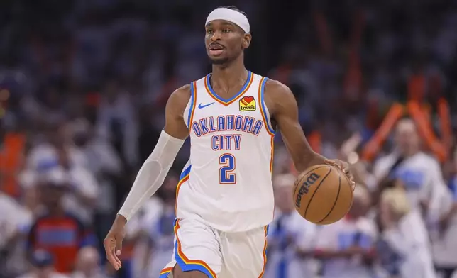 Oklahoma City Thunder guard Shai Gilgeous-Alexander dribbles the ball up court against Minnesota Timberwolves during the second half of Game 1 of an NBA basketball Western Conference Finals playoff series Tuesday, May 20, 2025, in Oklahoma City. (AP Photo/Nate Billings)