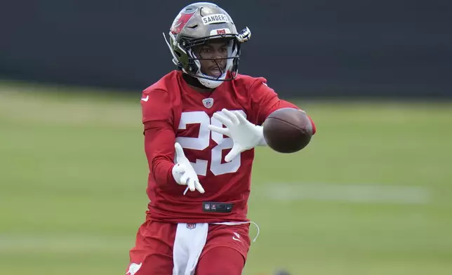 Tampa Bay Buccaneers safety Shilo Sanders catches the ball during the NFL football team's rookie minicamp Friday, May 9, 2025, in Tampa, Fla. (AP Photo/Chris O'Meara)