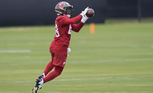 Tampa Bay Buccaneers safety Shilo Sanders catches the ball during the NFL football team's rookie minicamp Friday, May 9, 2025, in Tampa, Fla. (AP Photo/Chris O'Meara)