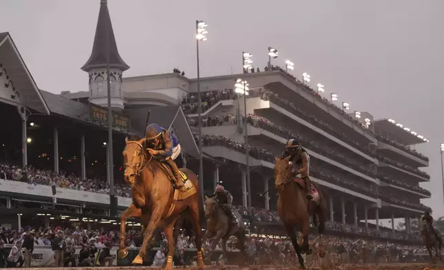 Sovereignty, ridden by Junior Alvarado, left, crosses the finish line to win the 151st running of the Kentucky Derby horse race at Churchill Downs Saturday, May 3, 2025, in Louisville, Ky. (AP Photo/Abbie Parr)