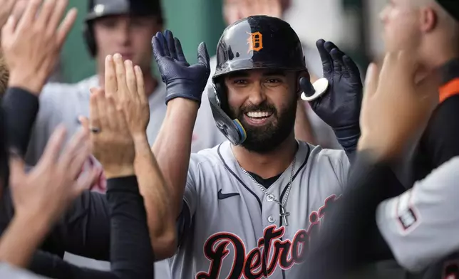 Detroit Tigers' Riley Greene celebrates in the dugout after hitting a two-run home run during the first inning of a baseball game against the Kansas City Royals, Friday, May 30, 2025, in Kansas City, Mo. (AP Photo/Charlie Riedel)