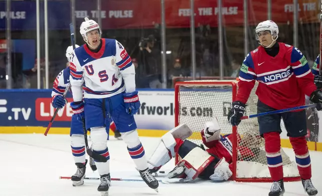 USA's Michael McCarron, front left, reacts after scoring his side's fourth goal during the group B match between USA and Norway at the IIHF Ice Hockey World Championships in Herning, Denmark, Wednesday, May 14, 2025. (Bo Amstrup/Ritzau Scanpix via AP)
