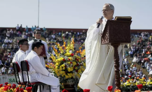 Pope Leo XIV, then Apostolic Administrator of Chiclayo Robert Prevost, preaches during a Corpus Christi celebration in a stadium in Chiclayo, Peru, Friday, June 19, 2015. (AP Photo/Julio Reano)