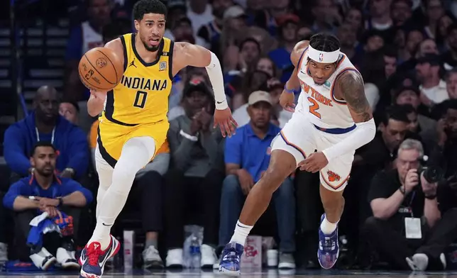 FILE - Indiana Pacers guard Tyrese Haliburton (0) dribbles during the first half of Game 7 in an NBA basketball second-round playoff series against the New York Knicks, May 19, 2024, in New York. (AP Photo/Julia Nikhinson, File)
