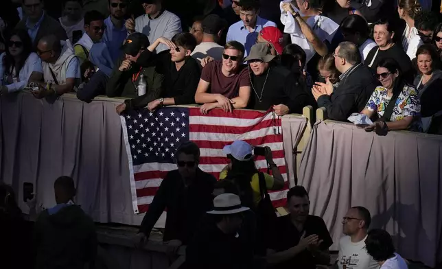 Crowds wait for the announcement of Pope Leo XIV's election, in St. Peter's Square at the Vatican, Thursday, May 8, 2025. (AP Photo/Gregorio Borgia)