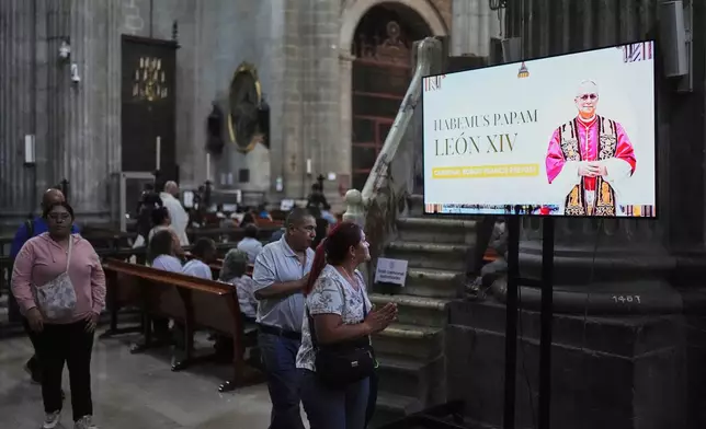 An image of the newly elected Pope Leo XIV fills a screen during Mass at the Metropolitan Cathedral in Mexico City, after his election, Thursday, May 8, 2025. (AP Photo/Eduardo Verdugo)