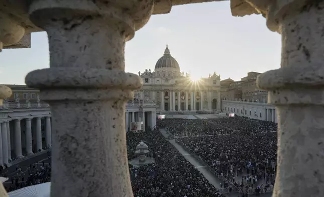 Crowds wait for Pope Leo XIV to appear on the balcony of St Peter's Basilica after his election, at the Vatican, Thursday, May 8, 2025. (AP Photo/Antonio Calanni)