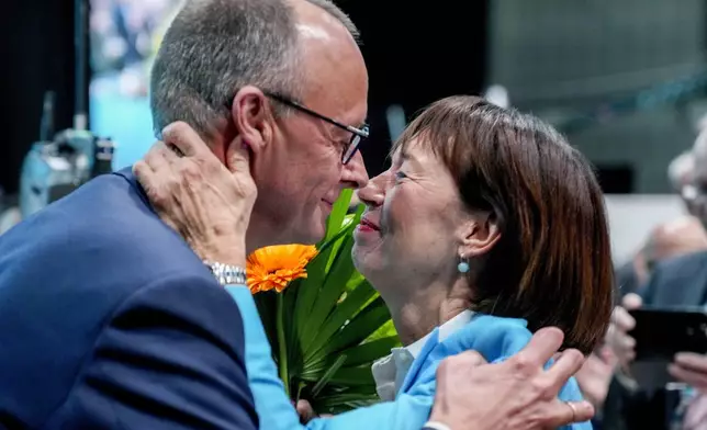 FILE - Christian Democratic Party leader Friedrich Merz is congratulated by his wife after his re-election at a CDU party convention in Berlin, Germany, May 6, 2024. (AP Photo/Ebrahim Noroozi, File)
