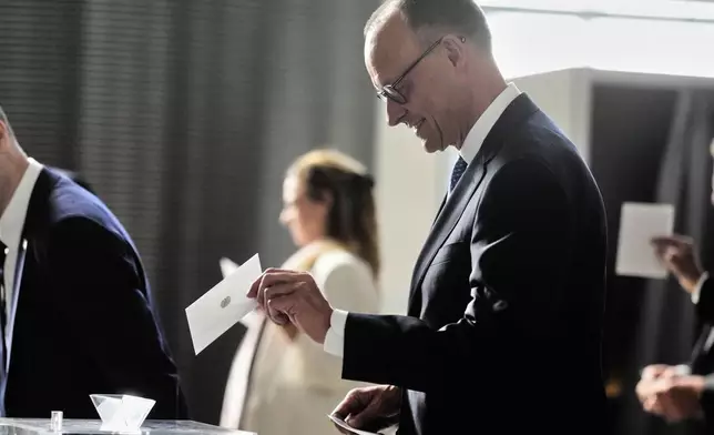 Leader of the Christian Democrats Friedrich Merz casts his vote for a second round of the election of a new chancellor at the German federal parliament, Bundestag, at the Reichstag building in Berlin, Germany, Tuesday, May 6, 2025. (AP Photo/Markus Schreiber)