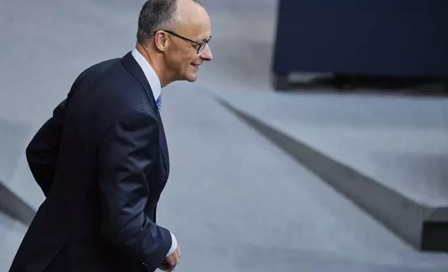 Friedrich Merz waits for the beginning of a session where he is expected to be elected new chancellor in the German federal parliament, Bundestag, at the Reichstag building in Berlin, Tuesday, May 6, 2025. (AP Photo/Ebrahim Noroozi)